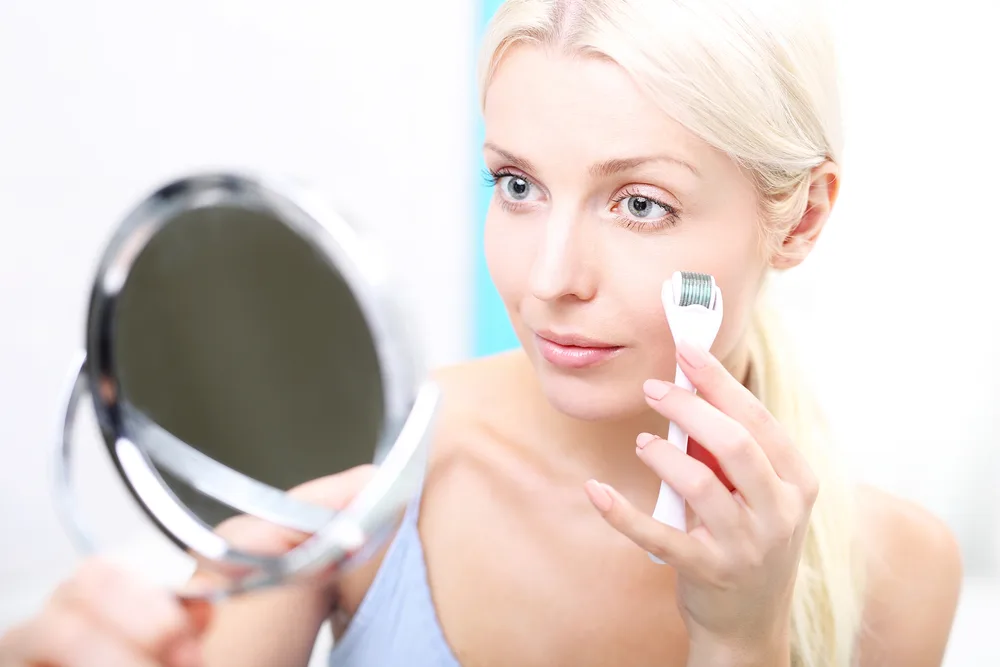 woman microneedling at home