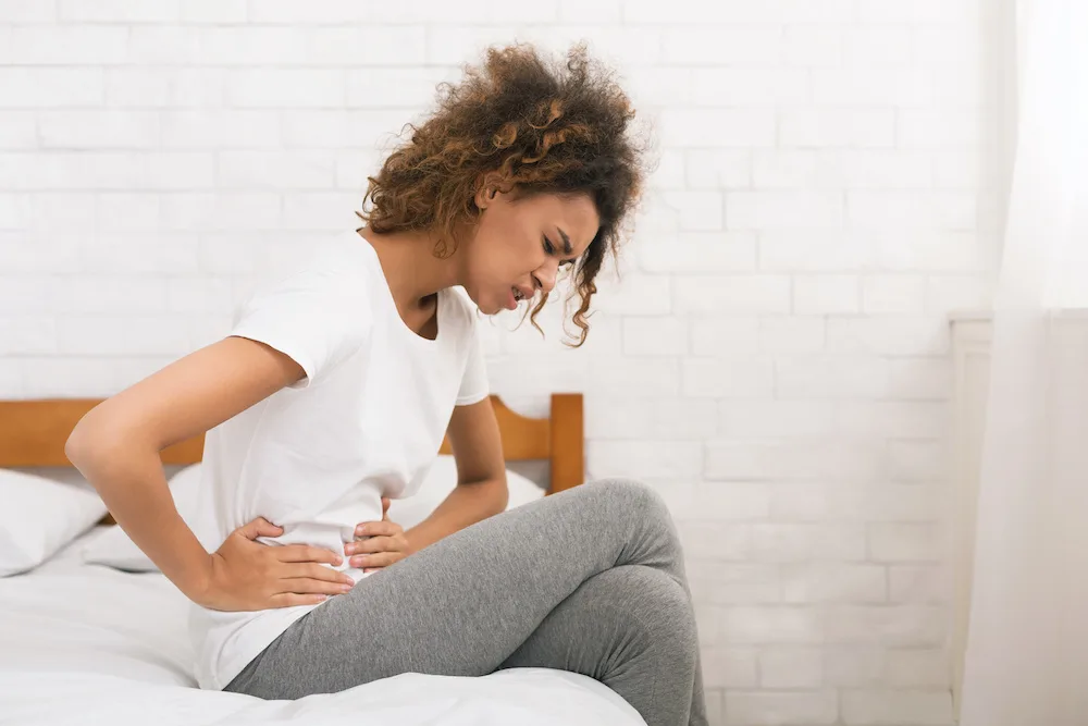 Woman suffering from a Bartholin Abscess or a Bartholin's cyst
