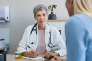 woman talking to a doctor about her infected bartholins cyst