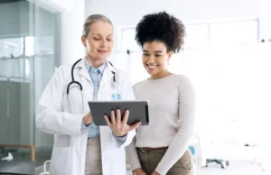 A doctor discussing potential treatment plans with new patient.