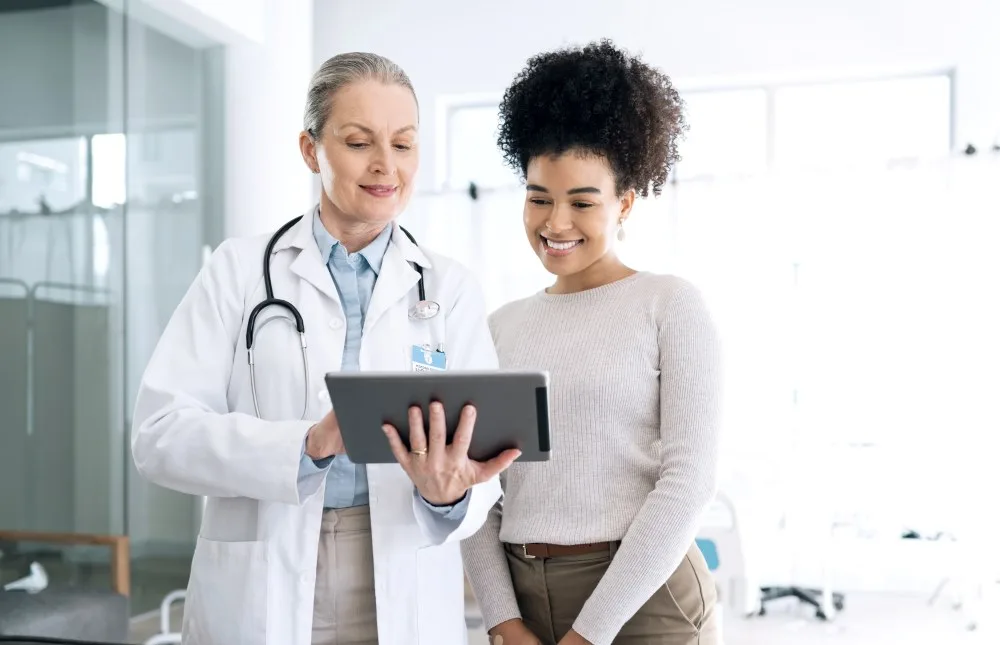 A doctor discussing potential treatment plans with new patient.