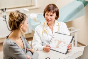 A woman speaking with her gynecologist about her cosmetic surgery.