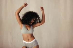 Woman celebrating her newfound confidence in herself.